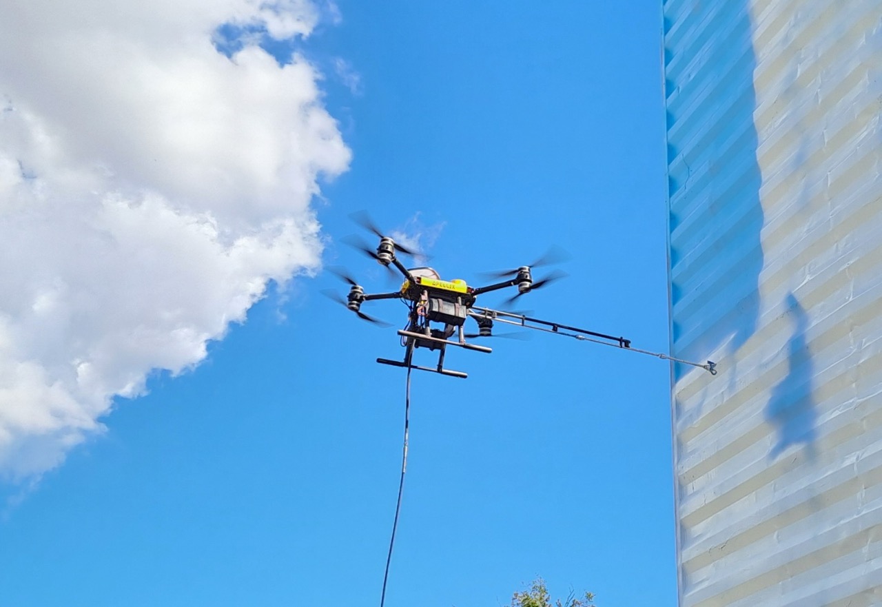 Apellix tethered spray drone system with ground-based pure water supply